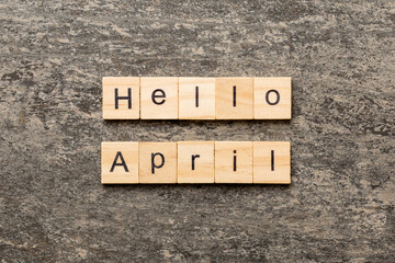 hello april word written on wood block. hello april text on table, concept