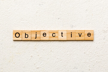 objective word written on wood block. objective text on table, concept