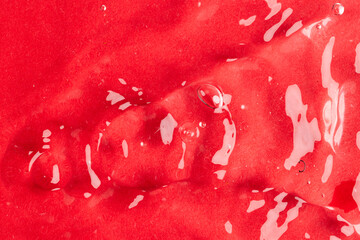 Close up of water ripples and waves with copy space on red background