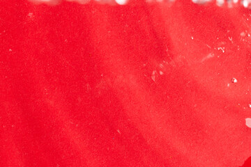 Close up of water ripples and waves with copy space on red background