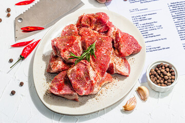Paper culinary recipe for preparation pork. Raw ingredients includes pork loin pieces, spices, herbs