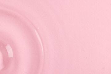 Close up of water ripples and waves with copy space on pink background
