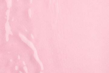 Close up of water ripples and waves with copy space on pink background