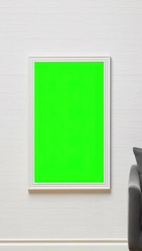 Frames on the wall green screen. Vertical video