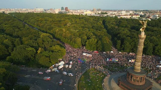Nice aerial top view flight 
CSD Pride Parade 2023 city Berlin Germany Summer evening Victory Column. tilt up drone
4K Cinematic footage.