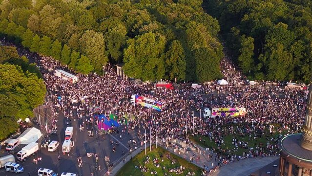 trucks, Great aerial top view flight 
CSD Pride Parade 2023 city Berlin Germany Summer evening Victory Column. drone top down Above view
4K Cinematic footage.