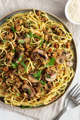 Homemade Mushroom, Spinach & Sausage Spaghetti on a Plate, top view. Overhead, from above, flat lay.