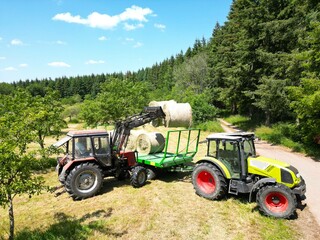 Working in the field on a tractor, harvesting