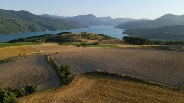 Aerial view of Serre-Poncon lake with Saint-Michel Bay. Summer in Durance Valley. Hautes-Alpes (Alps), France