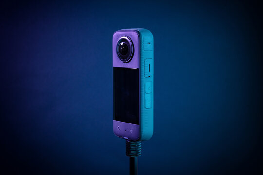 Modern 360 degree digital camera on black background