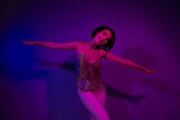 Photo of cheerful lady enjoy new year christmas event occasion flying dance isolated neon color background