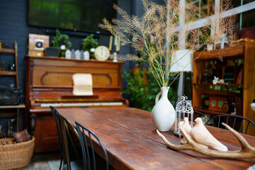 Retro living room of a country house with wooden furniture and vintage elements