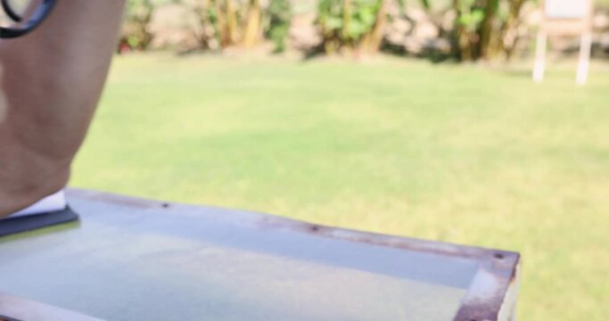 Man shooting gun and getting recoil 4k movie. Male entertainment concept