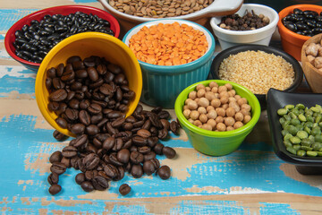 assorted bowls with raw grain and seeds top view