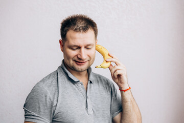 The guy communicates on a banana like a phone