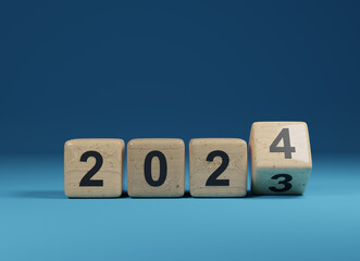 Flipping wooden cubes with the Year number 2023 and 2024, New Year concept