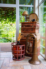 antique suitcases, wind and percussion instruments as interior decoration