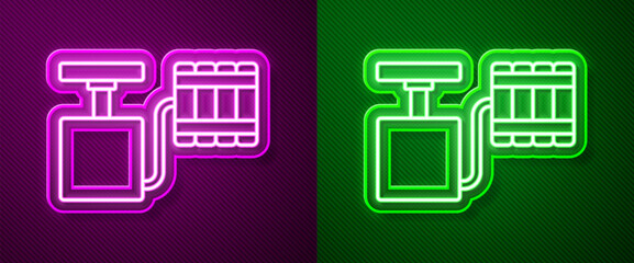 Glowing neon line Handle detonator for dynamite icon isolated on purple and green background. Vector