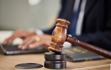Judge, hammer and man hands on laptop for legal research, typing report and compliance, justice or...