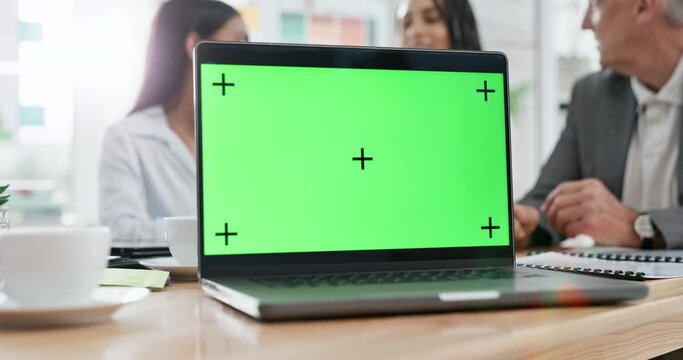 Business people, laptop and green screen mockup in meeting for strategy, planning or team discussion at office. Group of employees in teamwork collaboration with computer display and tracking markers