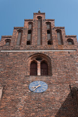 Fototapeta na wymiar medieval Church standing tall on a sunny summerday in Denmark.