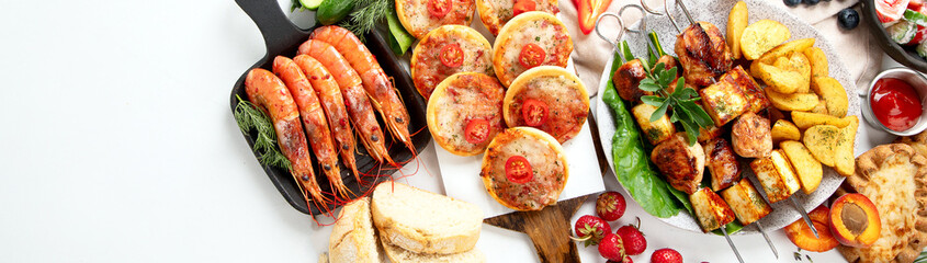 Family dinner or lunch. Many dishes on the table. Summer.