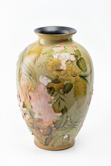 Ceramic vase with paint flaking and cracking texture on a white background. Selective focus