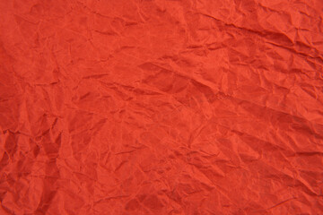 Red crumpled paper texture pattern. Rough grunge old blank.