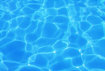 Fototapeta na wymiar water in swimming pool rippled water detail background