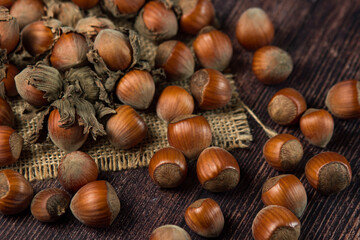 Hazelnuts on a wooden table. Hazelnut in shell