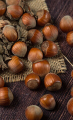 Hazelnuts on a wooden table. Hazelnut in shell