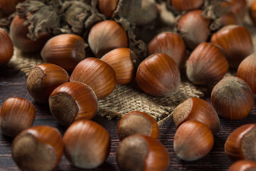 Hazelnuts on a wooden table. Hazelnut in shell