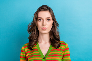 Portrait of young confident serious face lady brown curly hair wear striped stylish shirt it consultant isolated on blue color background