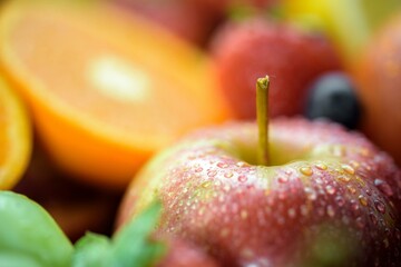 Refreshing and Crisp: Close-Up of Washing a Fresh Apple in 4K Resolution