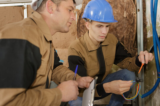two electrician working in construction site