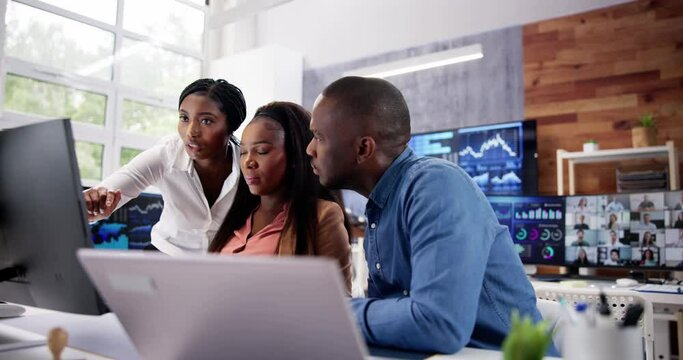 African Financial Data Analysts Using Dashboard On Screens