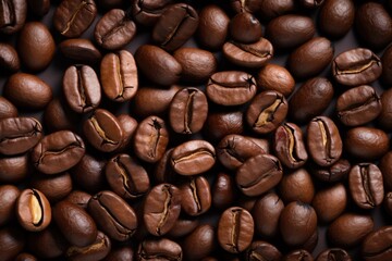 Obraz premium Fresh roasted coffee beans closeup pattern on dark background. Food pattern. Love coffee concept. Top view, flat lay with copy space
