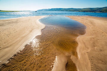 beautiful sandy beaches shallows on the Volga river against the background of the Zhiguli mountains...