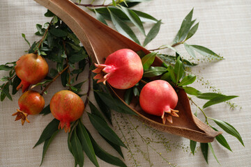 Pomegranates on the table, the symbol of the Jewish new year - Rosh Hashanah. View from above