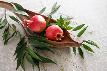 Pomegranates on the table, the symbol of the Jewish new year - Rosh Hashanah. View from above