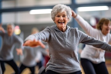 Group of smiling senior people dancing while enjoying activities in retirement home - concept
