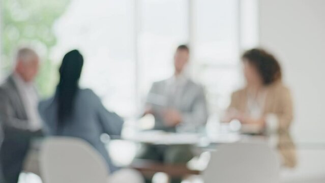 Business people, meeting in blurred office and documents for proposal, workshop and brainstorming together. Team pitch, investment review or budget planning discussion, men and women in b2b deal.