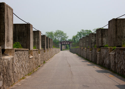 North Korean anti tank invasion concrete blocks on the roadside on the Demilitarized Zone, North Hwanghae Province, Panmunjom, North Korea