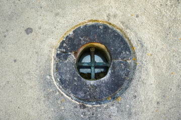 round antique window in the wall of the old castle. High quality photo