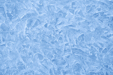 Naklejka na ściany i meble Ice background texture. Frozen water in various geometric abstract shapes. Seasonal natural effect. Cold weather. The surface of the winter water reservoir.