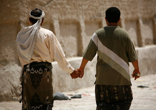 Sign of friendship between two men in Hadramout, Yemen ;