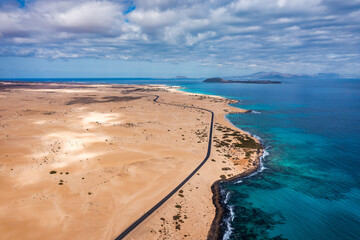 Aerial view of beach in Corralejo Park, Fuerteventura, Canary Islands. Corralejo Beach (Grandes Playas de Corralejo) on Fuerteventura, Canary Islands, Spain. Beautiful turquoise water and white sand.