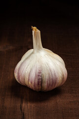 Garlic bulb close up on wooden background