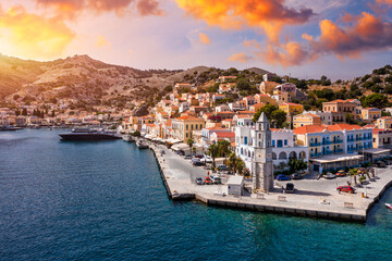 Fototapeta na wymiar Aerial view of the beautiful greek island of Symi (Simi) with colourful houses and small boats. Greece, Symi island, view of the town of Symi (near Rhodes), Dodecanese.
