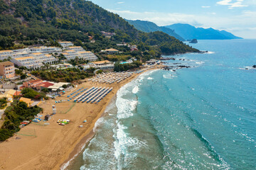 Aerial drone view over western coast and Glyfada beach, Island of Corfu, Greece. Glyfada Beach at Corfu Greece during the day.